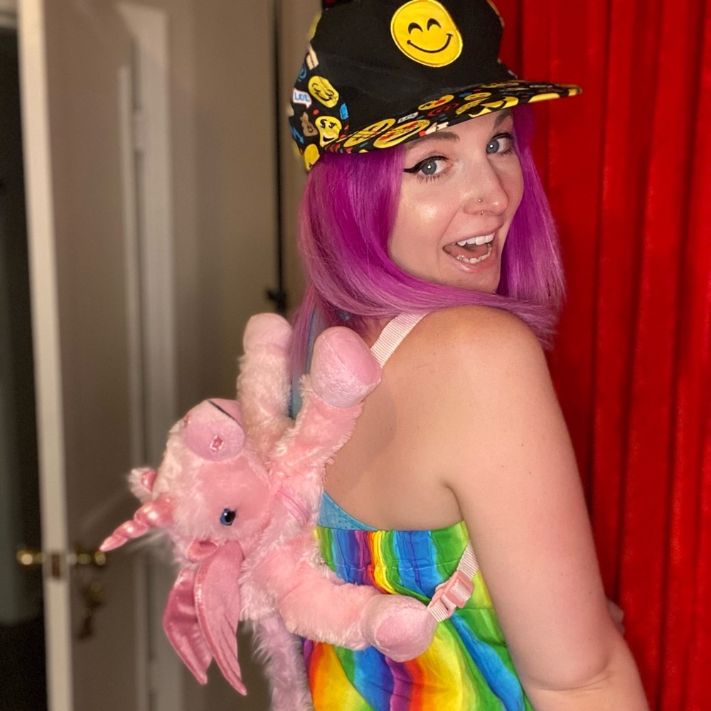 Pink plush unicorn backpack